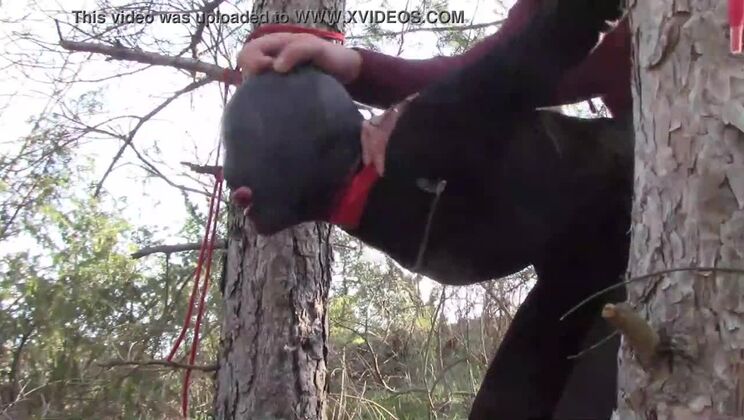 Tied up to a tree outdoor on sexy clothes, wearing pantyhose and high ankle boots heels, rough fuck