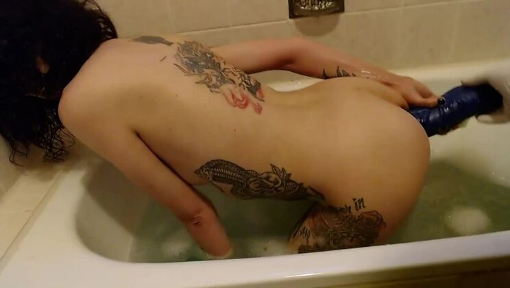 German slut takes a bath in her own piss, fucks huge dildos and gets a hard fistfuck