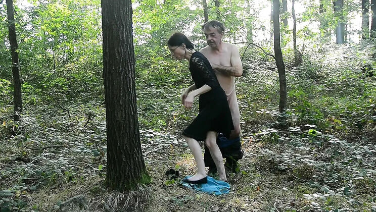 Baechel gives blowjob and handjob during a walk in the forest